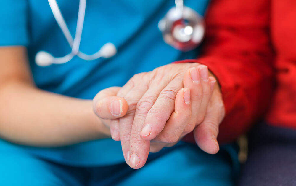 nurse-holding-patients-hand-medicare-health-insurance-wisconsin